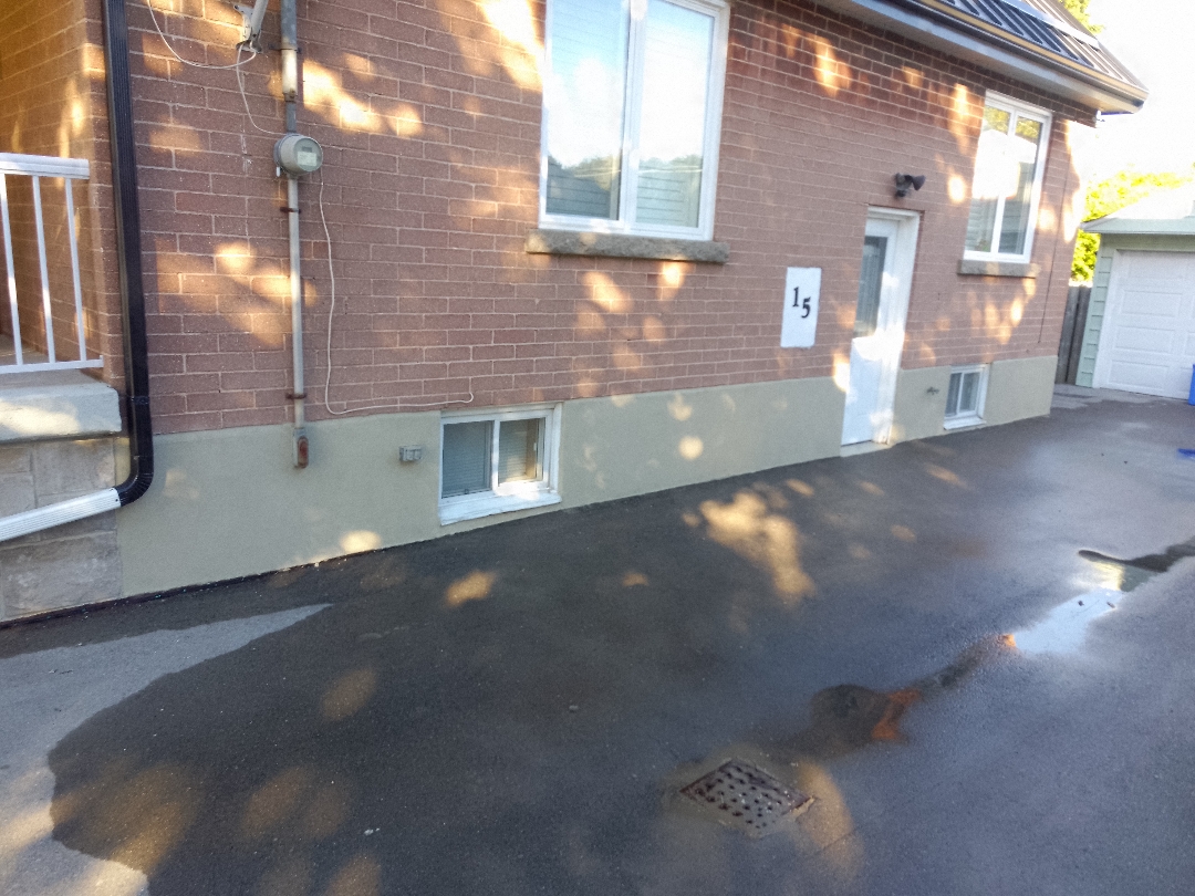 After parging - smooth, professionally restored foundation finish